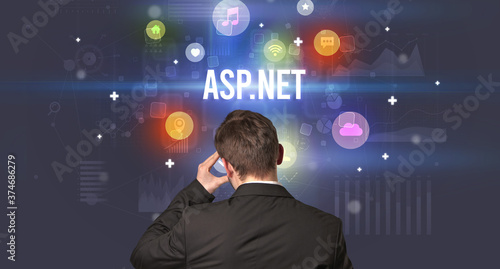 Rear view of a businessman with ASP.NET inscription, modern technology concept