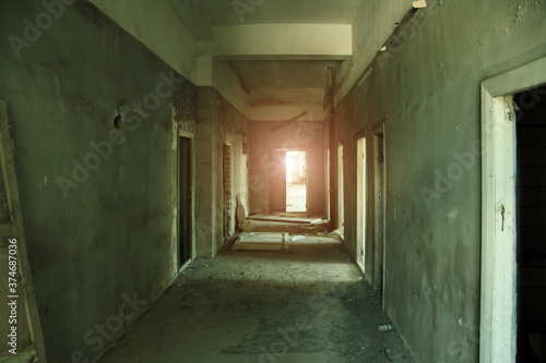Dark creepy empty corridor of abandoned building