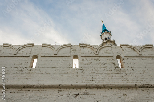 Old fortress wall made of white brick. photo