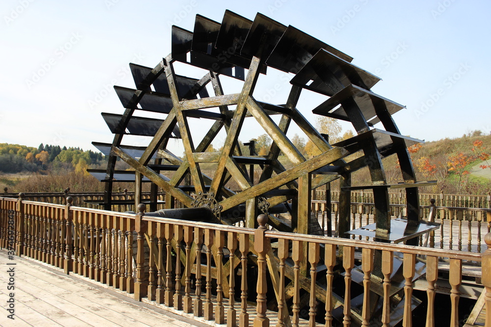 An old water wheel made of wood. Steampunk. Moscow region. Russia.