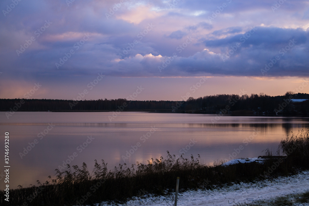 Fototapeta premium Beautiful landscape of thunderclouds over a quiet river.
