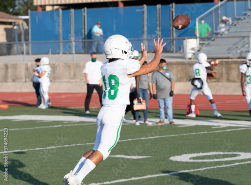 Great action photos of football players making amazing plays during a football game