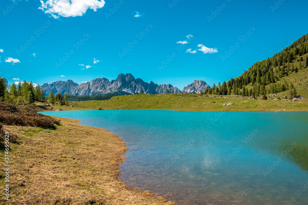 Calm lake in a sunny day  in the beautiful Carnic Alps, Friuli-Venezia Giulia, Italy