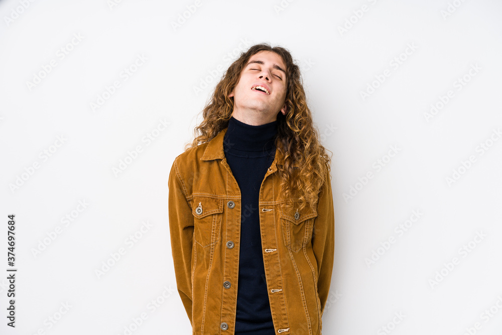 Long hair man posing isolated relaxed and happy laughing, neck stretched showing teeth. Long hair man posing isolated relaxed and happy laughing, neck stretched showing teeth.