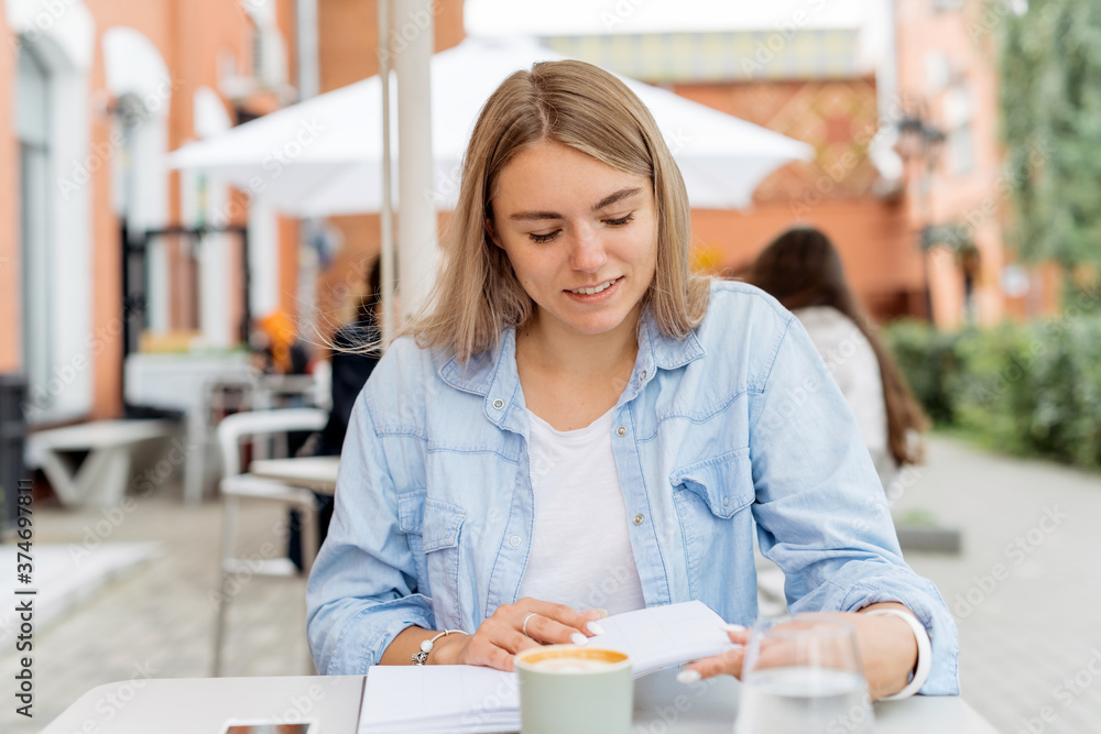 Smart business owner planning her business.
Beautiful blonde woman writing in her diary Smart business owner planning her business.
Beautiful blonde woman writing in her diary