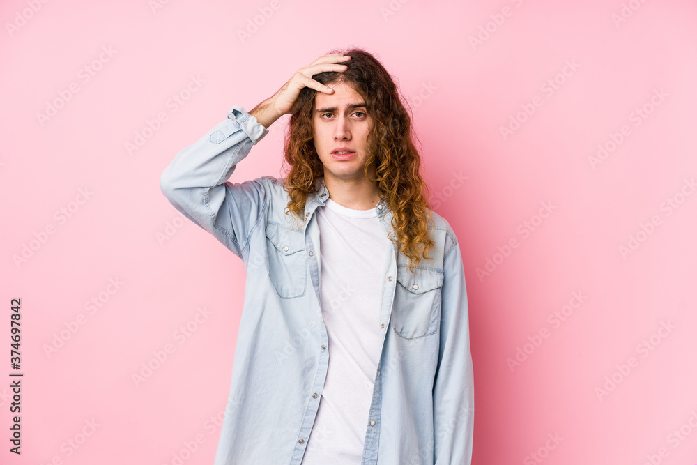Long hair man posing isolated being shocked, she has remembered important meeting. Long hair man posing isolated being shocked, she has remembered important meeting.