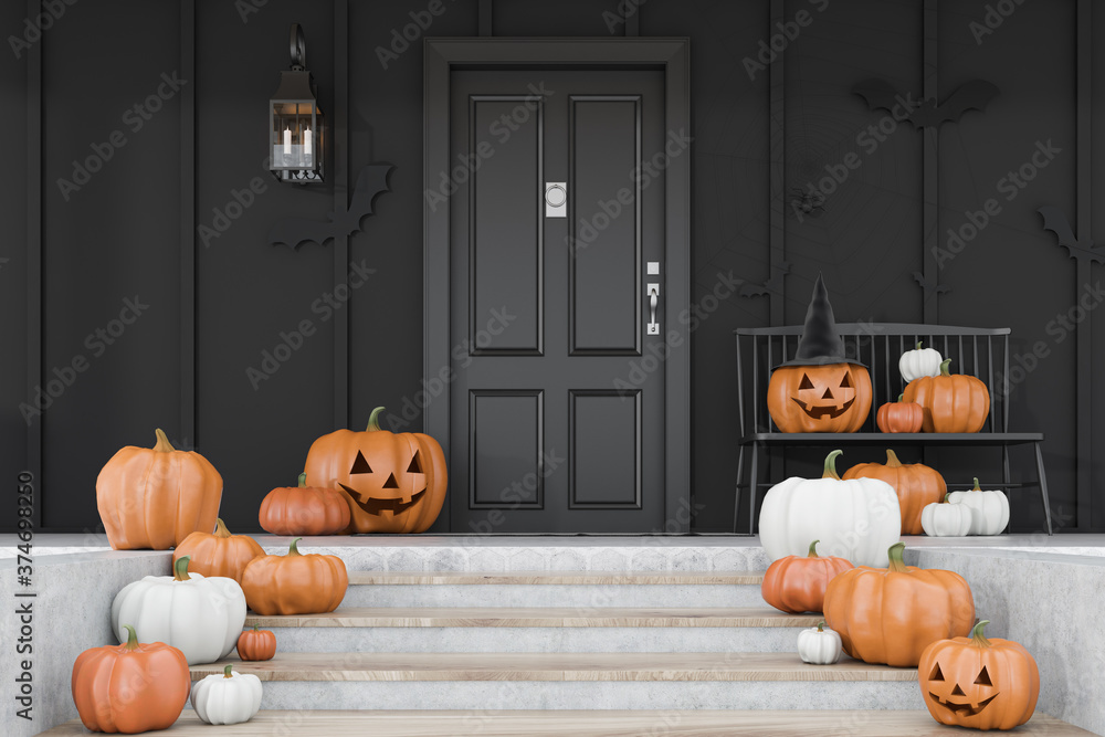 Obraz premium Carved pumpkins on stairs of black house