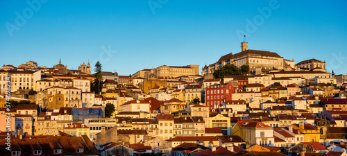 Old town of coimbra glows at night under a pretty summer sky, Portugal