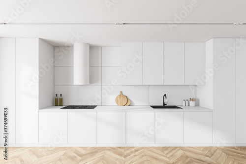 White kitchen interior with cabinets