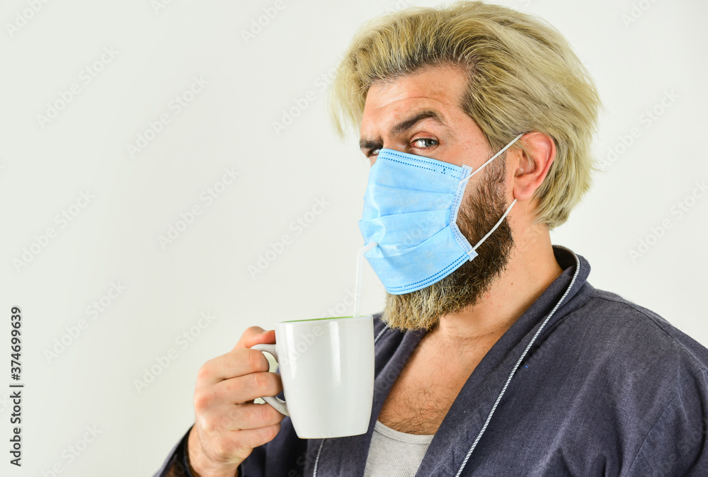 Totally protected. Wearing mask protect from coronavirus. Guy in mask drink tea coffee using straw. Serious about hygiene. Cover mouth and nose with mask and make sure no gaps between face and mask Totally protected. Wearing mask protect from coronavirus. Guy in mask drink tea coffee using straw. Serious about hygiene. Cover mouth and nose with mask and make sure no gaps between face and mask
