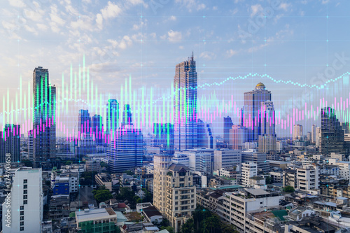 Sunset cityscape of Bangkok city view background with forex graph. Success and finance concept. Multiexposure