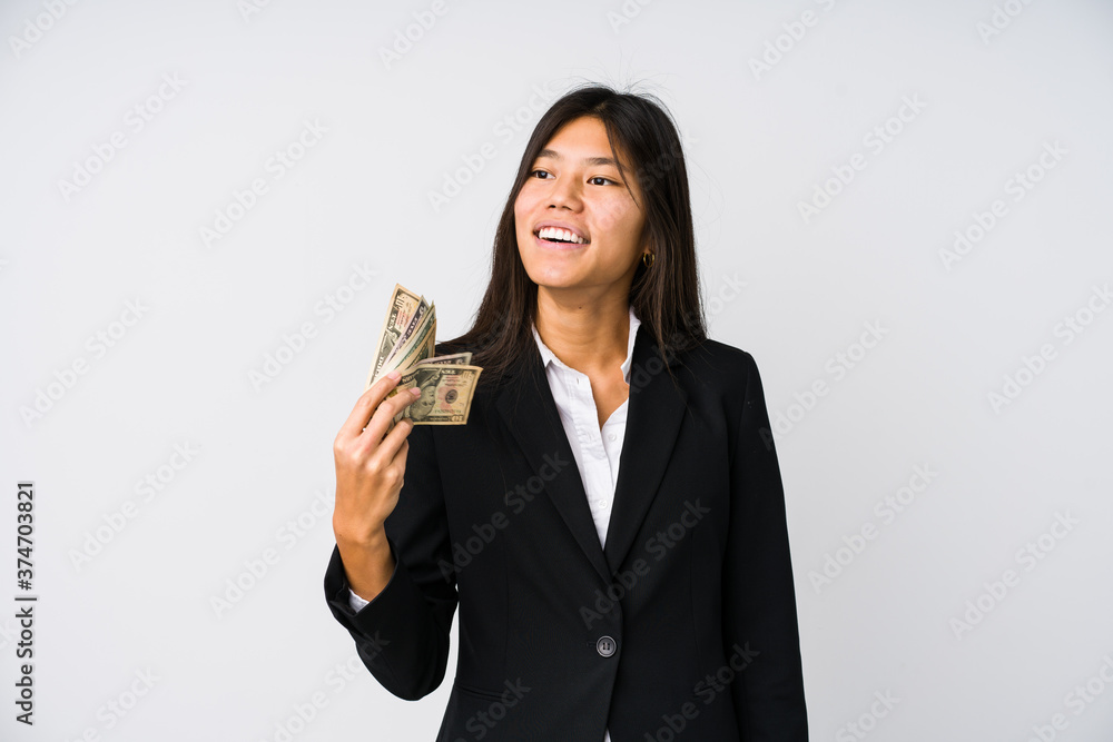 Young chinese business woman holding money isolated Young chinese business woman holding money isolated