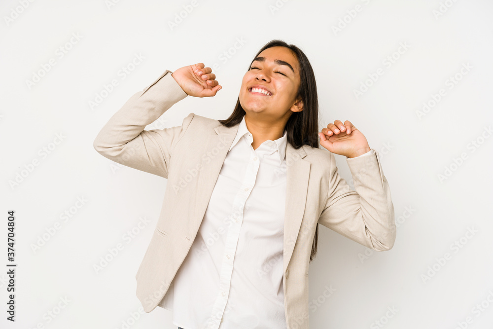 Young woman isolated on a white background stretching arms, relaxed position. Young woman isolated on a white background stretching arms, relaxed position.
