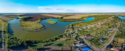 Wallpaper Mural Sunny summer and hot day - over the outskirts of the Kuban village of Sergievskaya near the Kirpili river with an island in summer
Wheat fields are visible across the river. Torontodigital.ca
