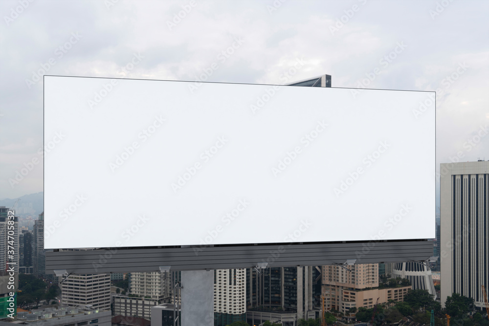 Blank white road billboard with KL cityscape background at day time. Street advertising poster, mock up, 3D rendering. Front view. The concept of marketing communication to promote or sell idea. Blank white road billboard with KL cityscape background at day time. Street advertising poster, mock up, 3D rendering. Front view. The concept of marketing communication to promote or sell idea.