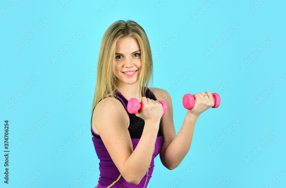 Strength and motivation. woman doing exercises with dumbbells. athletic woman with perfect body. sportswoman has strong biceps. Believe you can do more. powerlifting concept Strength and motivation. woman doing exercises with dumbbells. athletic woman with perfect body. sportswoman has strong biceps. Believe you can do more. powerlifting concept