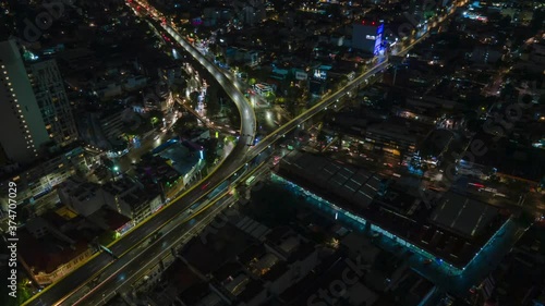 Aerial nighttime hyperlapse of a busy intersection in Mexico City, circle pan photo