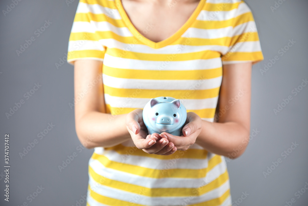 woman hand piggy bank