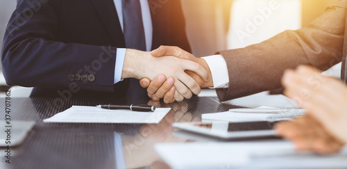 Wallpaper Mural Handshake as successful negotiation ending, close-up. Unknown business people shaking hands after contract signing in modern office Torontodigital.ca