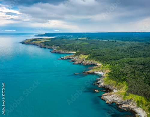 Aerial panoramic view of the wild beaches  surrounded by rocks and green dense forests on the southern Black Sea coast  Bulgaria