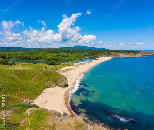 Fototapeta Naklejka Na Ścianę i Meble -  Aerial panoramic view of the wild beaches, surrounded by rocks and green dense forests on the southern Black Sea coast, Bulgaria