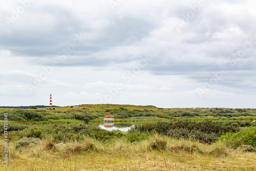 Lighthouse in a rural landscape on an island in the North Sea, Ameland, Holland