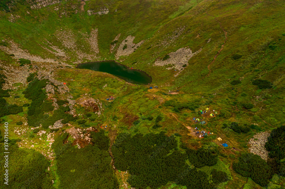 Carpathian lake Brebeneskul and rocky terrain near it, an attractive place for tourism, the highest lake of the Ukrainian Carpathians on the Montenegrin ridge.