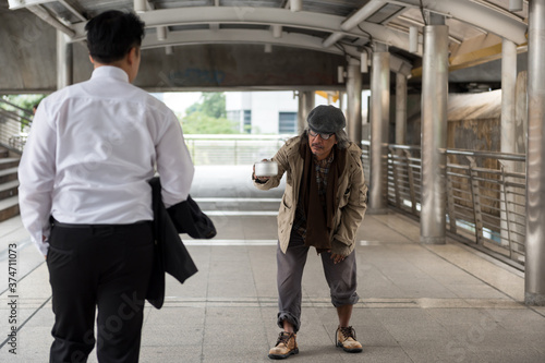 Homeless old man with bowl to beg money © Blanscape