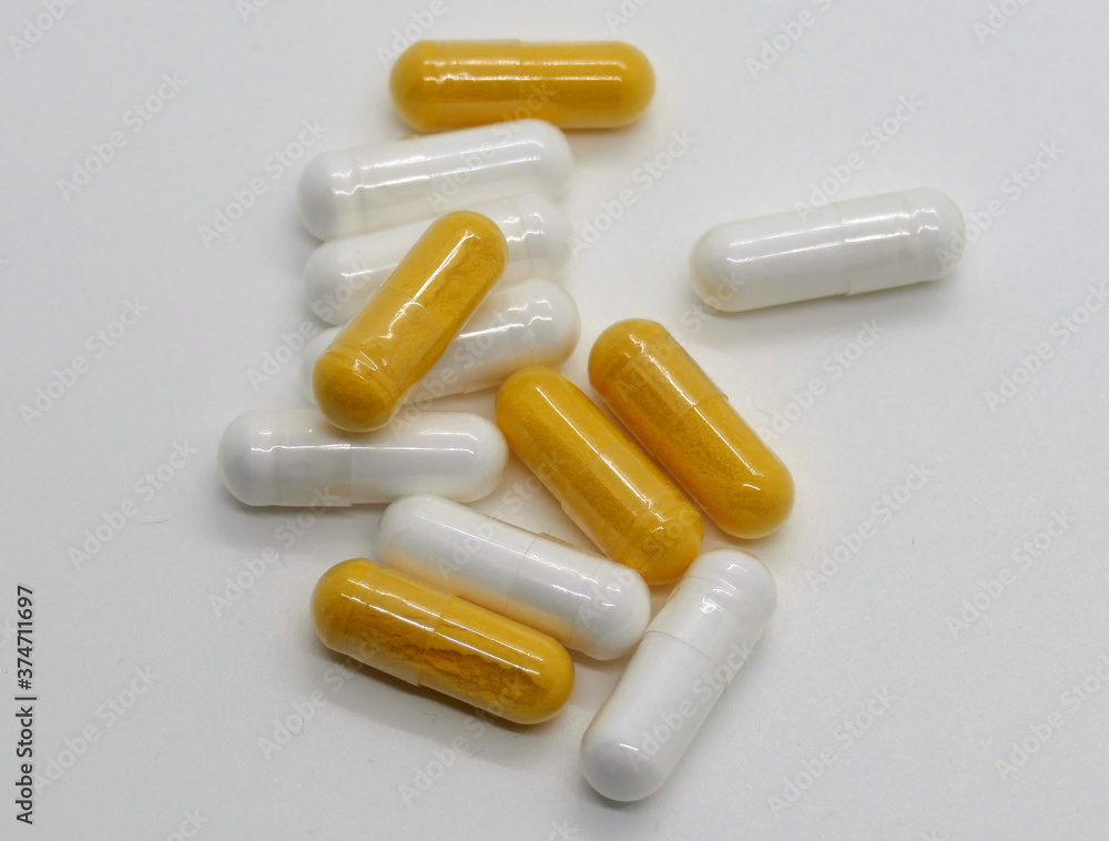 Weiße und orange Kapseln Weiße und orange Kapseln