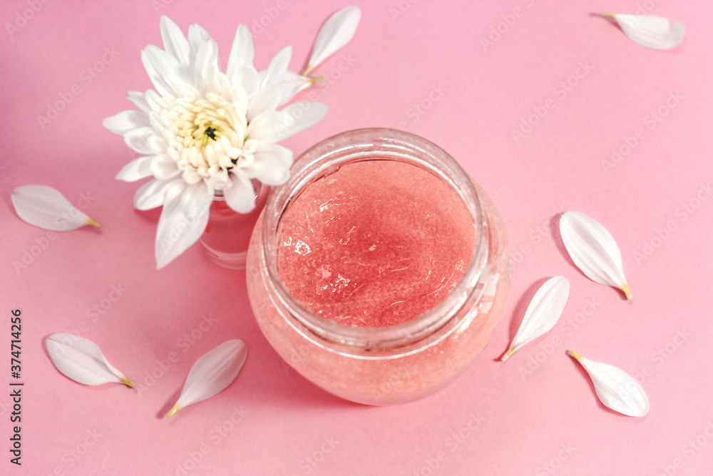 Chrysanthemum and petals with a natural body and face scrub. Space for text. Chrysanthemum and petals with a natural body and face scrub. Space for text.