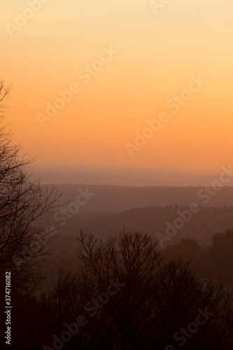 Fototapeta Naklejka Na Ścianę i Meble -  Sunset mountainous orange landscape