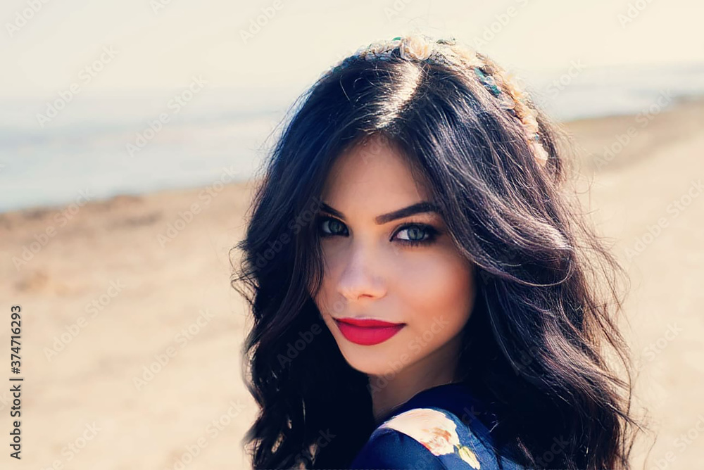 Portrait of a black-haired woman with bright makeup
Portrait of a black-haired woman with bright makeup