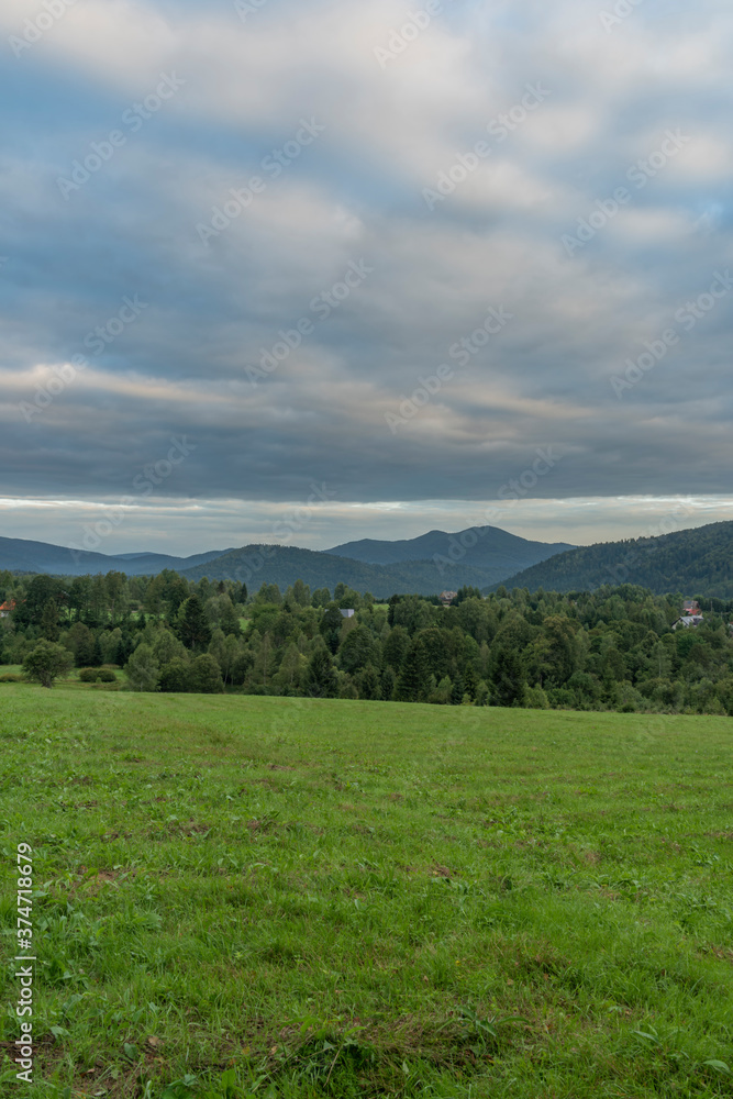 Sunrise near Przyslup village in summer cloudy morning