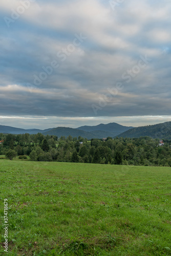 Sunrise near Przyslup village in summer cloudy morning