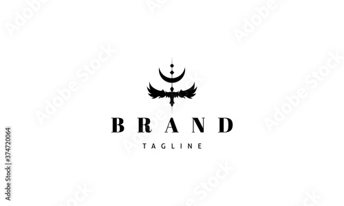 Vector logo on which an abstract image of a raven with outstretched wings and the moon on top.