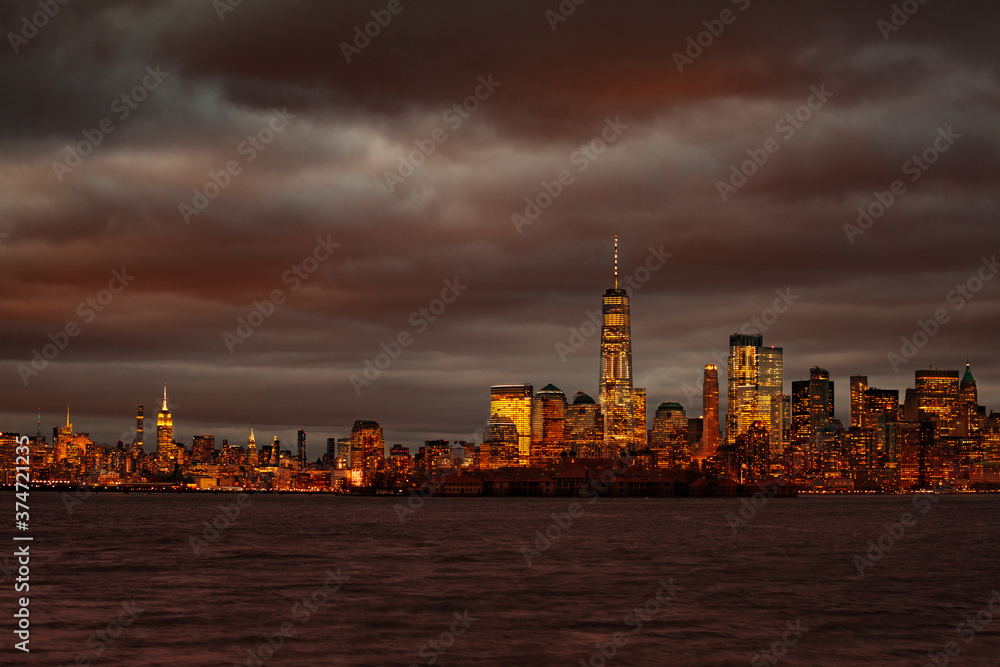 Moody night view of New York Manhattan downtown over Hudson river