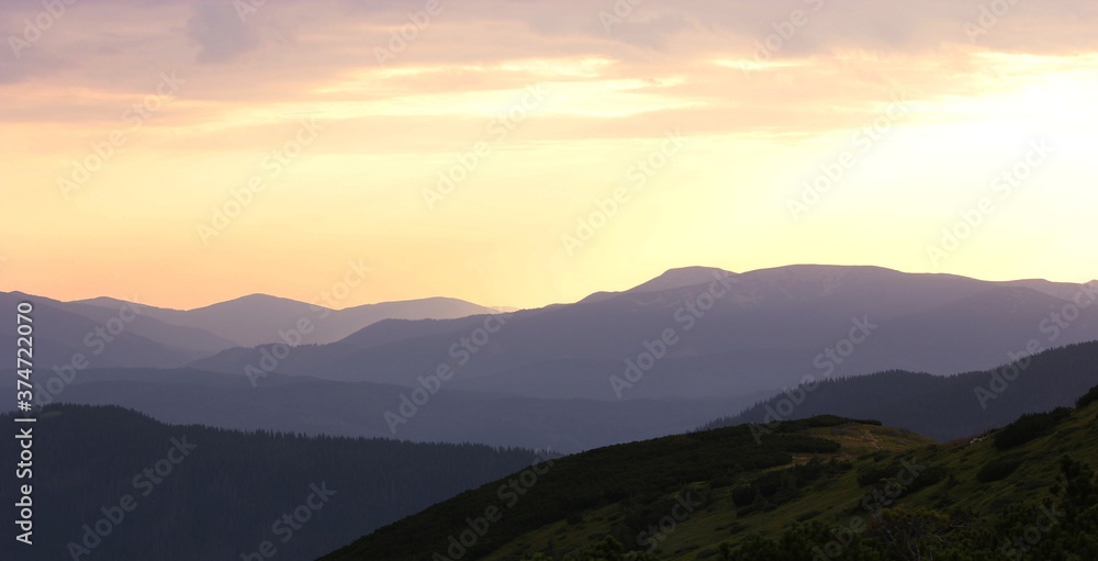 awesome autumn landscape, wonderful autumn morning in european mountains, forest on hill on background valley in  morning sunlight, Carpathian mountains, Ukraine, Europe
