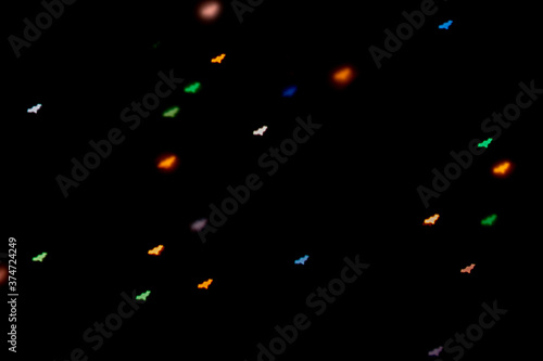 Wallpaper Mural Halloween background. Defocused bokeh multicolor lights in shape of bats on black background. Torontodigital.ca