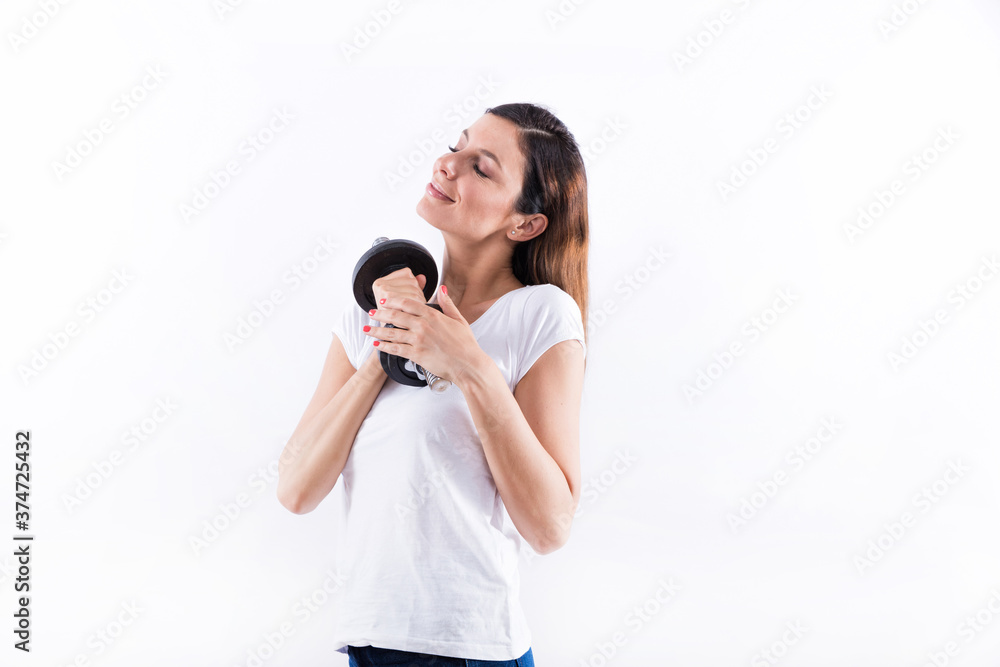 Fototapeta premium Young woman holding weight
