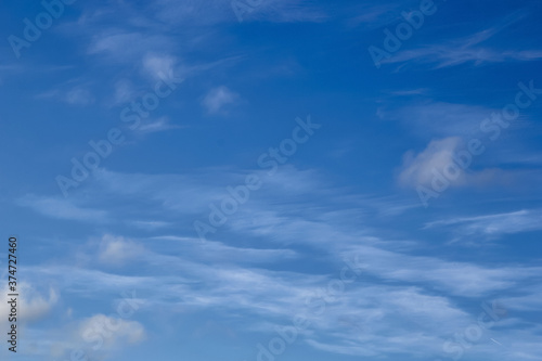 Blue sky background with white high clouds Altostratus, Cirrocumulus, Cirrus.