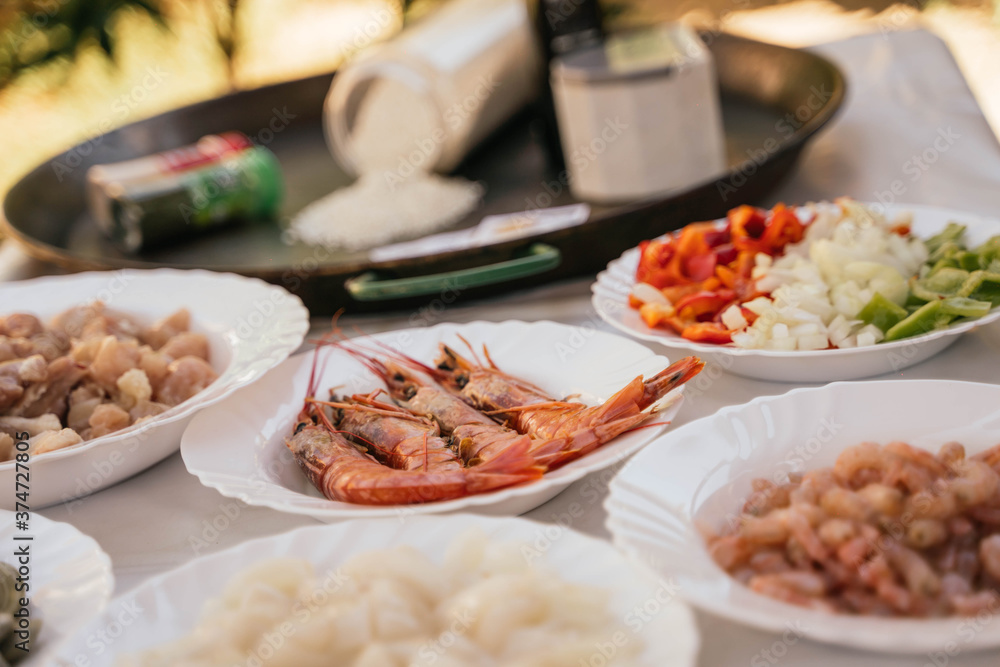 Prawns and garnish to prepare a typical seafood paella from Spain