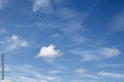 Blue sky background with white high clouds Altostratus, Cirrocumulus, Cirrus. © justoomm