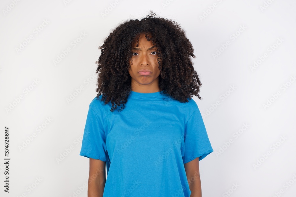 Portrait of displeased upset Young african woman with curly hair wearing casual frowns face as going to cry, being discontent and unhappy as can't achieve goals, Disappointed young woman Portrait of displeased upset Young african woman with curly hair wearing casual frowns face as going to cry, being discontent and unhappy as can't achieve goals, Disappointed young woman