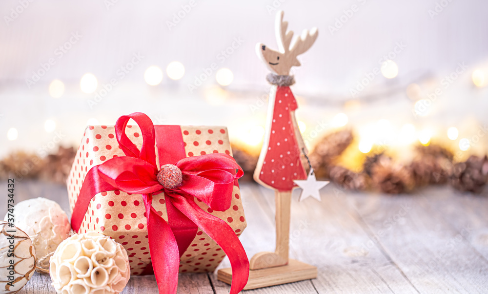 Beautiful Christmas background with Christmas toys and a gift box.