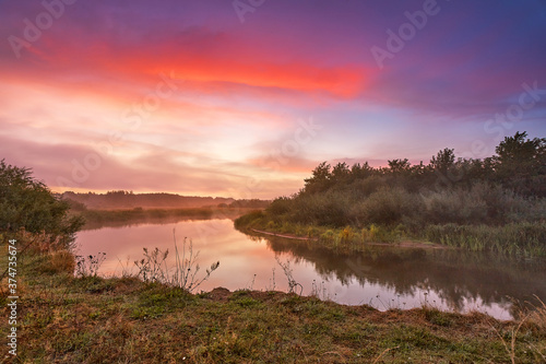 Obraz na płótnie River misty autumn sunrise. Colorful dawn. Cloudy sunrise. Dusk fall colors w salonie