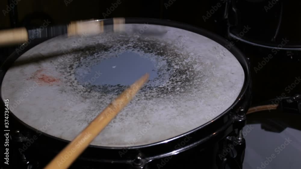 Close-up of a drummer's hand playing a drum kit. Close-up shot of a drummer playing a drum kit. Close-up of a drummer's hand playing a drum kit. Close-up shot of a drummer playing a drum kit.