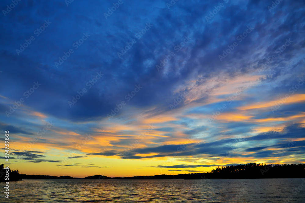 Fototapeta premium Beautiful fiery sunset. Lake Keret, Northern Karelia, Russia