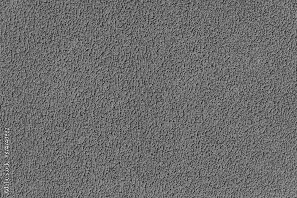 Painted wall texture, gray paint, dark background. Soft focus. Painted wall texture, gray paint, dark background. Soft focus.