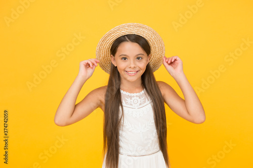 Adorable little girl wearing elegant hat. Have funny summer holiday. Summer tour. Leisure and entertainment concept. Summer happiness. Vacation mood. Tropical tour. Sale and discount. Goods for kids