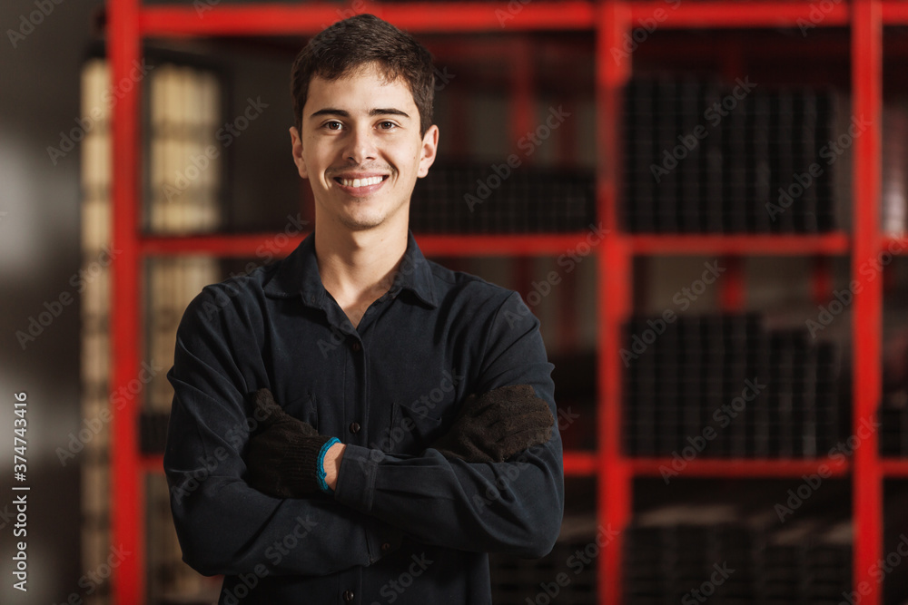 Small Latin entrepreneur in his shop of metal bars for construction. Small Latin entrepreneur in his shop of metal bars for construction.